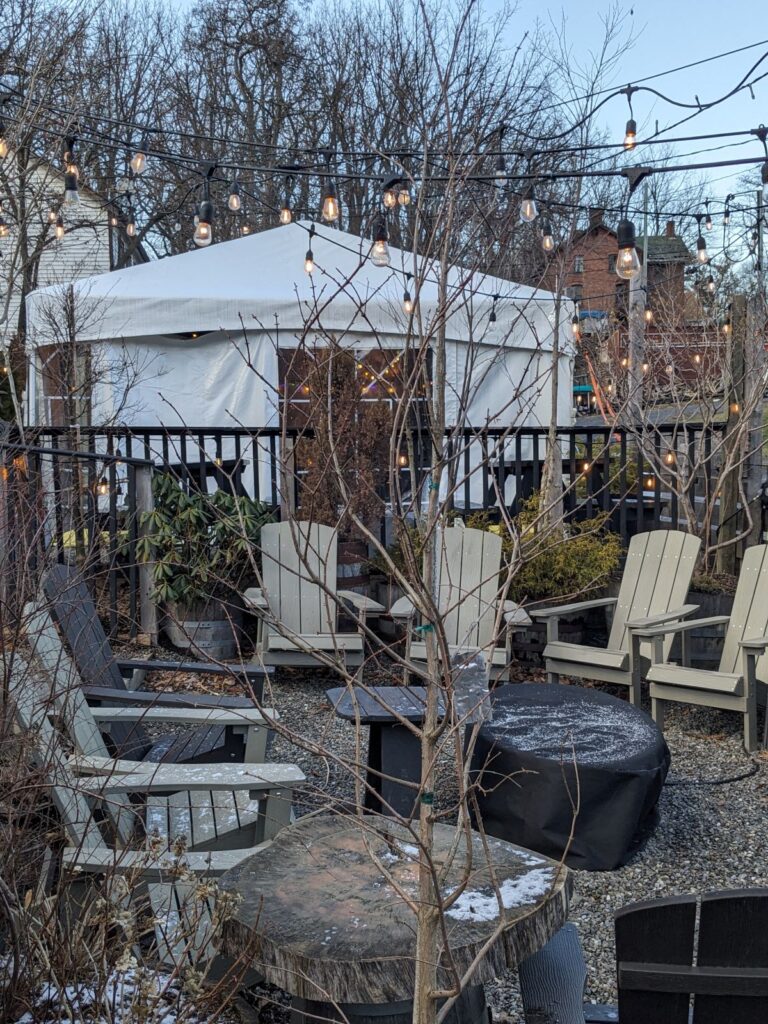 Outdoor seating area with Adirondack chairs.