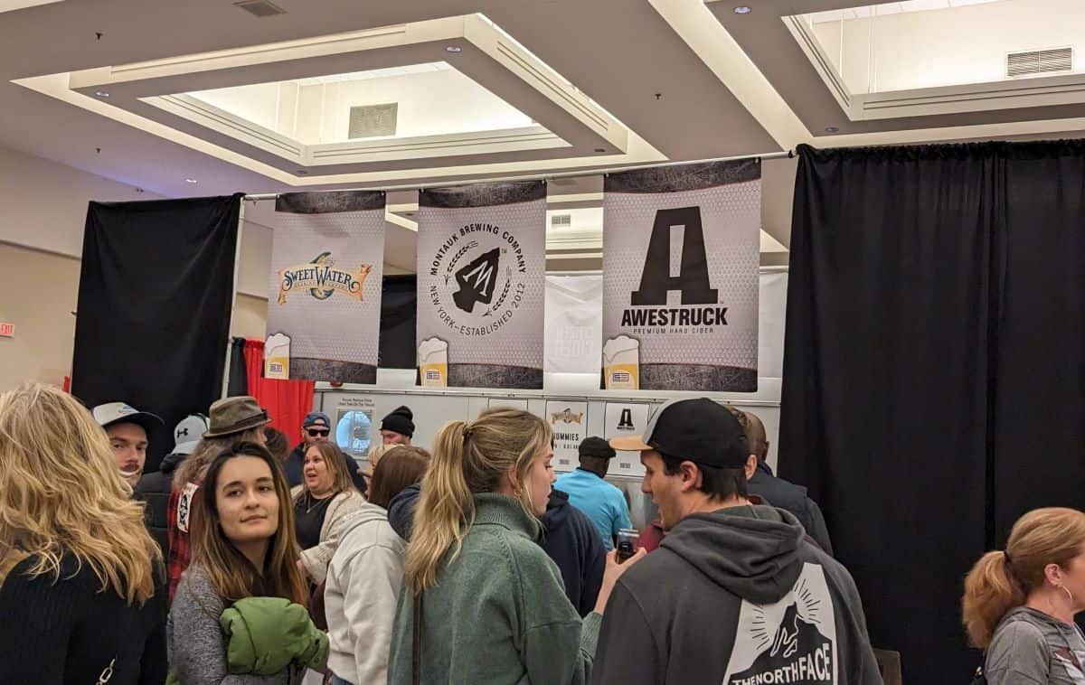 Different brewery banners and the crowd.