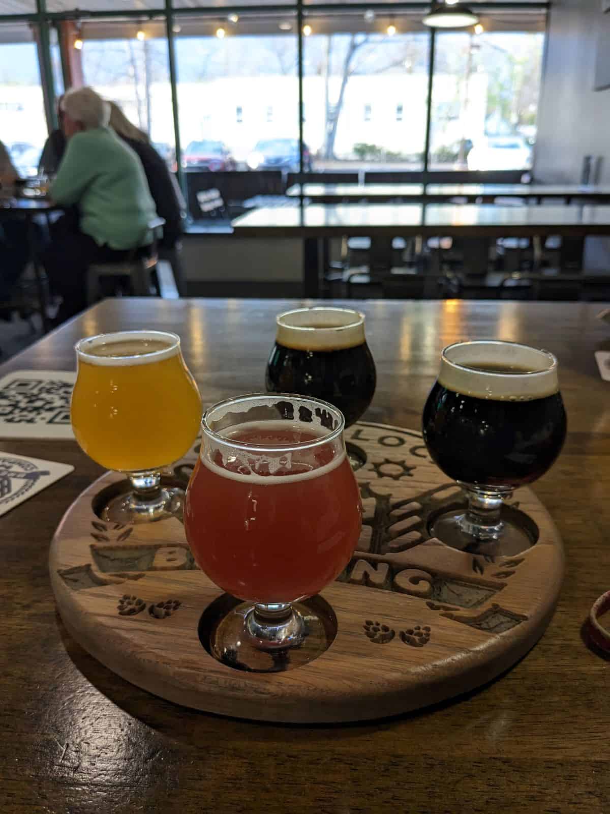 Flight of beer on table.