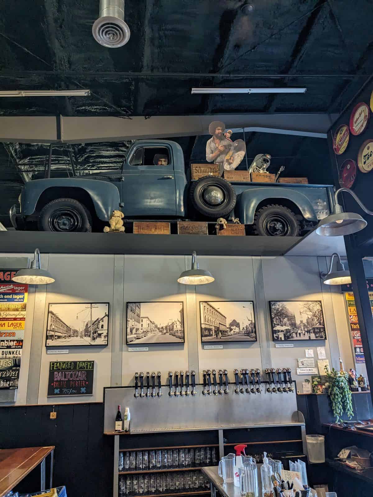 Wall of taps and old photographs.