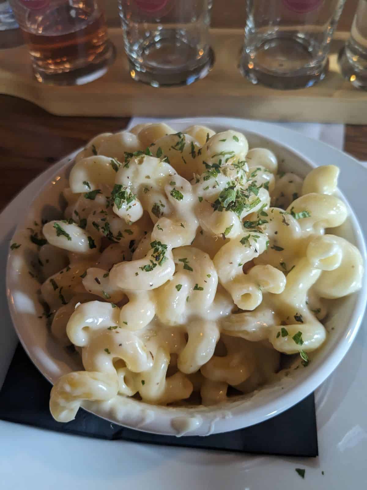 Dish of Macaroni and cheese on the bar.