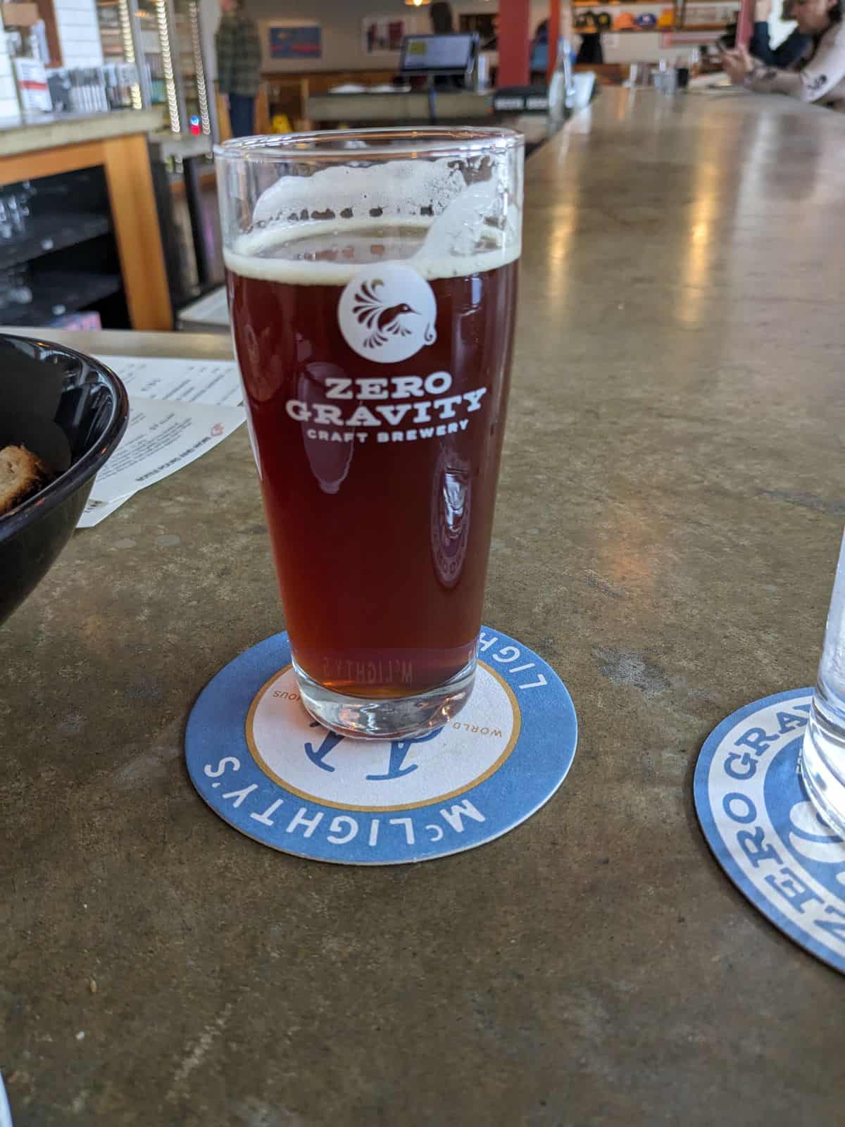 Glass of Scotch Ale on the bar.