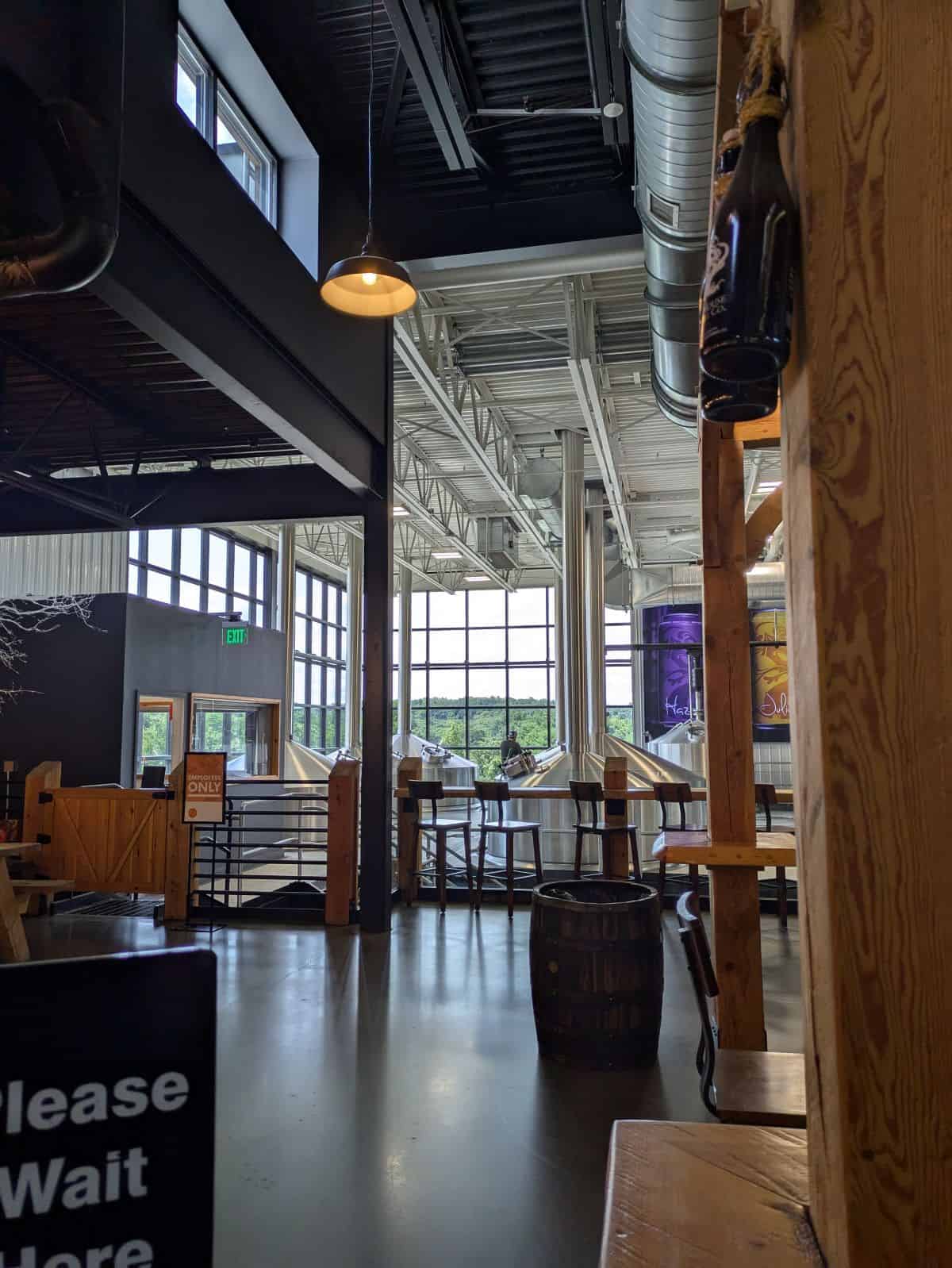 Taproom seating near tanks.