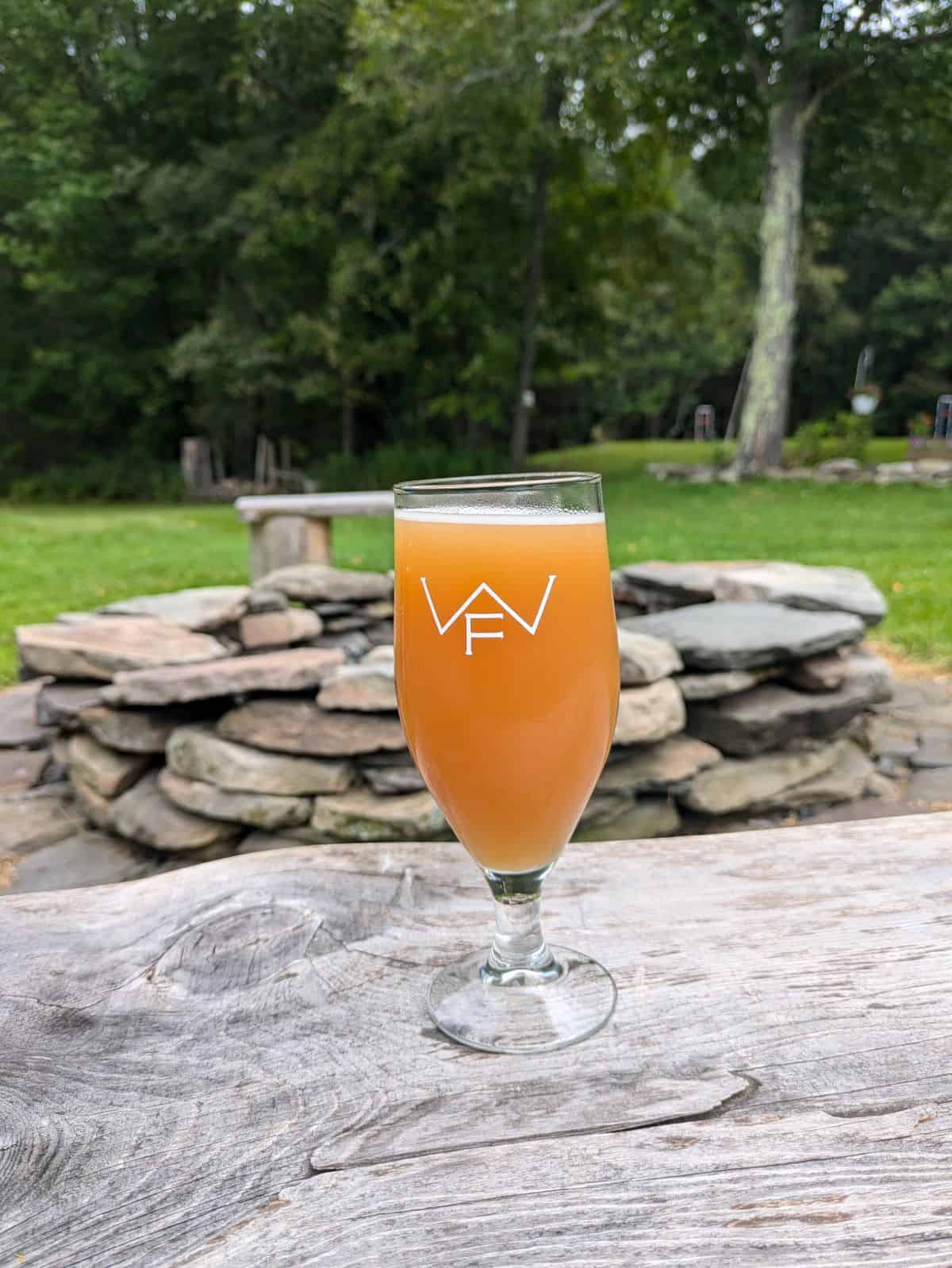 Glass of beer on a table.