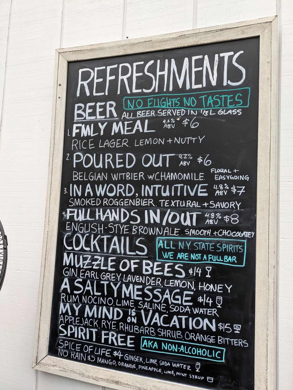 Drink menu on chalkboard.